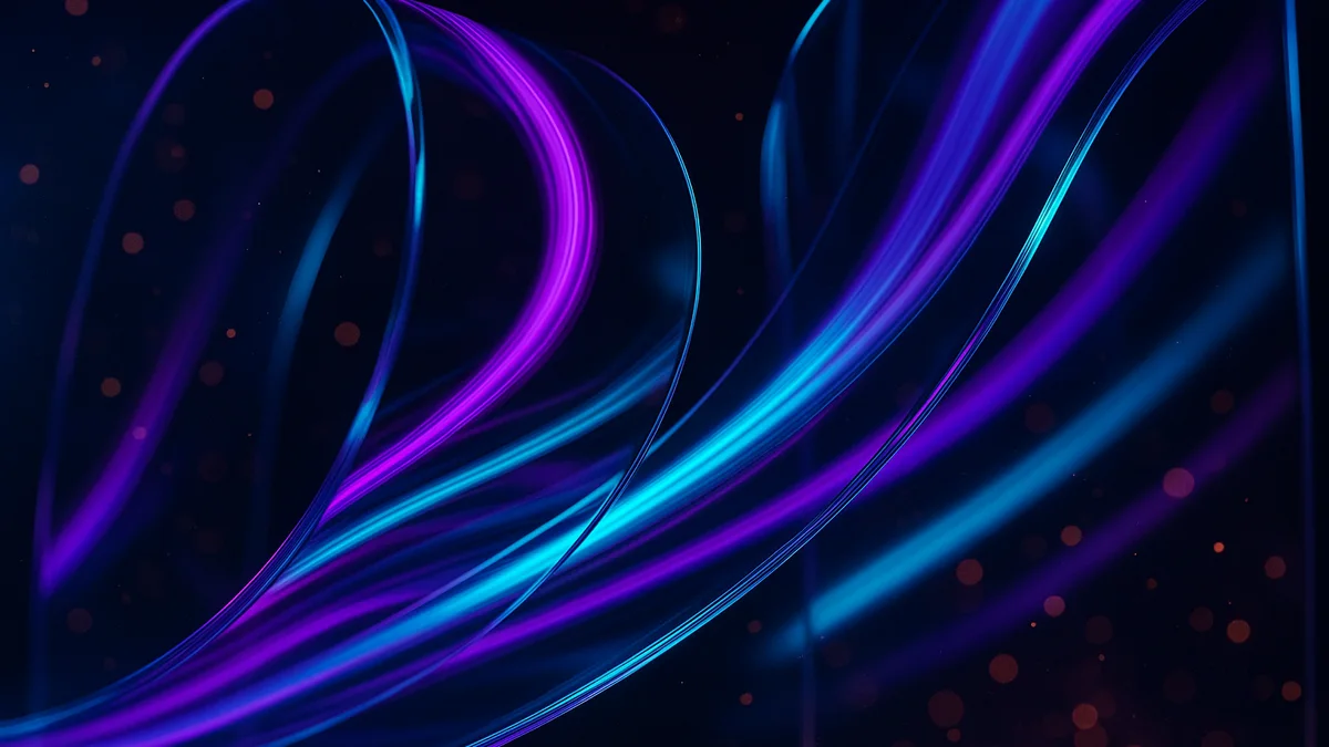 Purple and cyan neon light flowing through glass panels in a dark creative studio